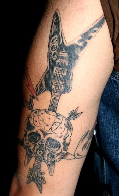 Skull Tattoos and V Guitar Skull tattoo victory guitar Get rock now