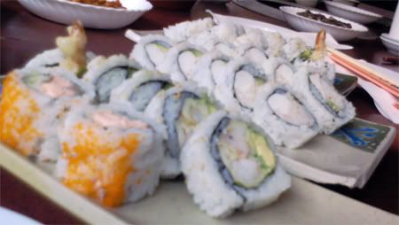 california rolls with avocado, crab stick, salmon, and tempura shrimp from a korean-japanese restaurant