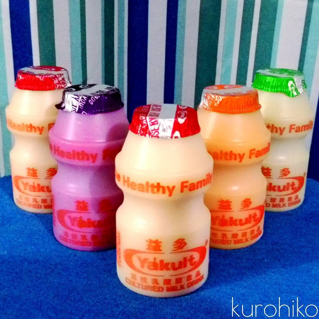 yakult's many flavors: original, grape yakult, apple yakult, and orange yakult