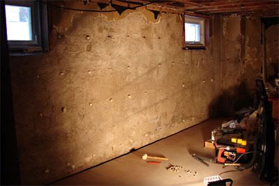 Strapping holes in concrete filled with Stuff It insulating foam and random severed body parts.