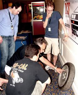 Jeff Synor and others curiously examine my odd spare DMC wheel.