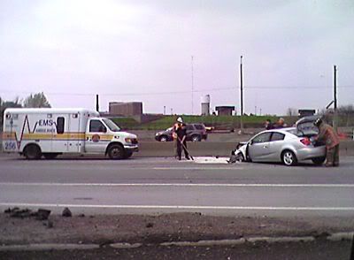 Ambulance drivers, desperate for work, crashed into this Saturn on the highway.