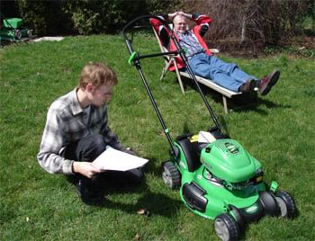 Father-in-law lazing it up while I prepare the mower for action.