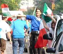 Fans celebrating Italy's world cup win, with strangers.