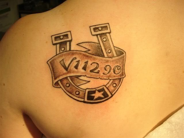 I have my thoroughbred's tattoo number on my shoulder: