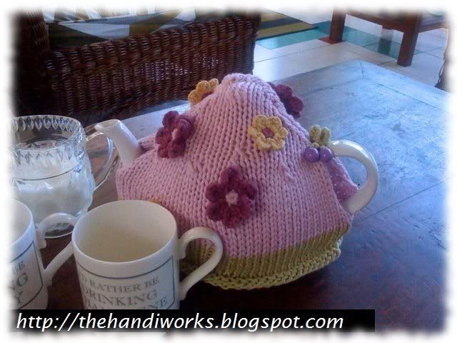 hand knitted garden scene teapot cosy 