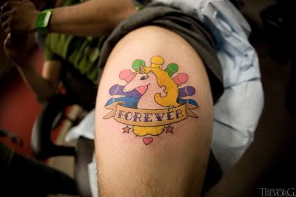 This is on Catfish's thigh. Hell yes those are dicks and a Unicorn.
