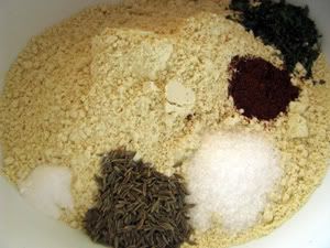 Dry ingredients. Most of this is chickpea flour. From top, going clockwise: dried parsley, chili powder, salt, cumin seeds, baking soda